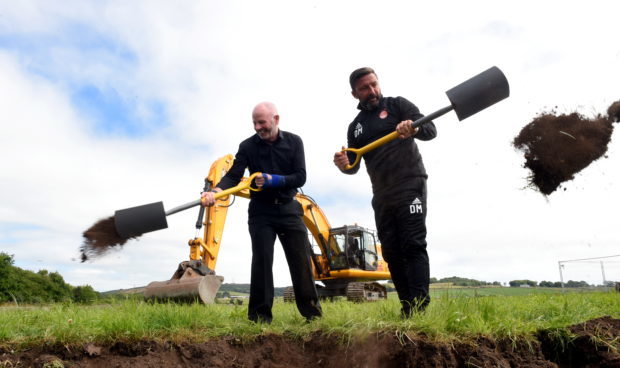 Stewart Milne and Derek McInnes start work on the construction of the new Dons stadium in September of last year
