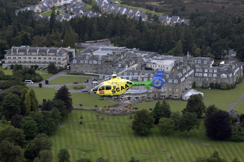 ‘Helimed 76’ is pictured flying over Gleneagles Hotel