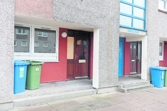 The charred front door and letterbox of 105 Old Town Road, Inverness, following what is thought to have been a deliberate fire.