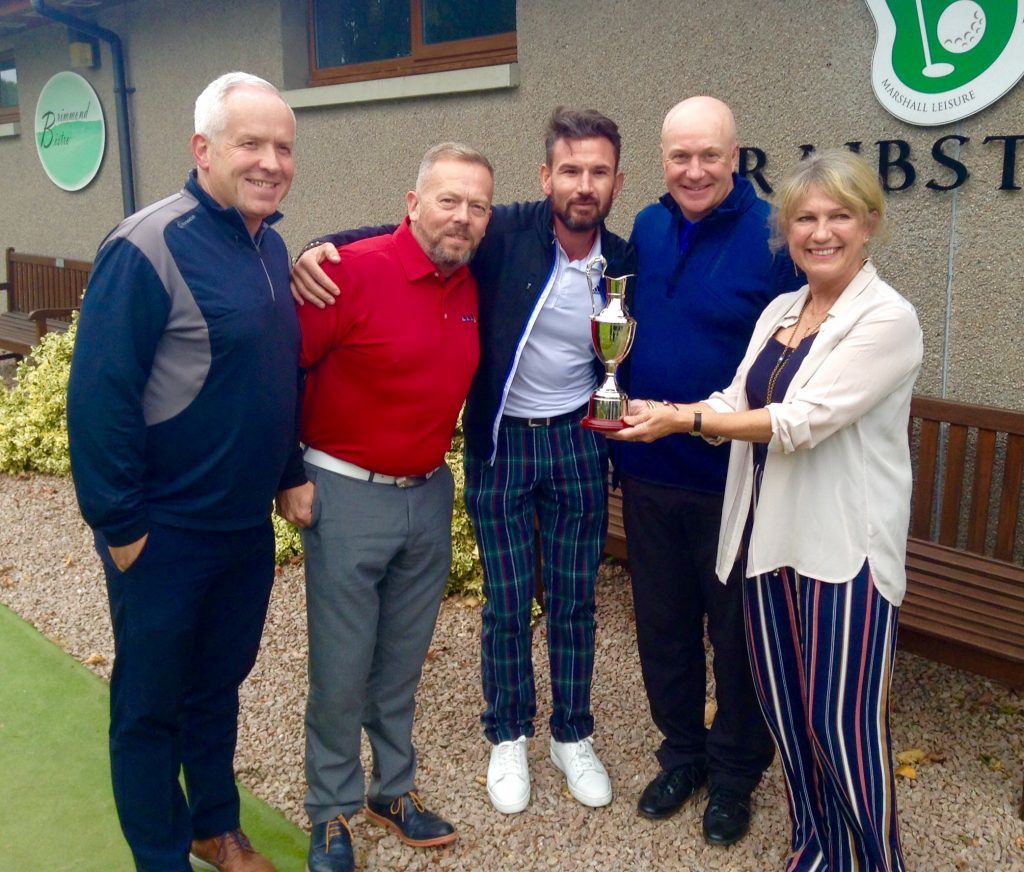 DREAM TEAM: Neale Cooper’s sister, Shirley Blake, presents the trophy to winning team Tenaris Global Services, who are Graham Watson, Mike Halliday, Darren Chilton and Mike Ritchie.