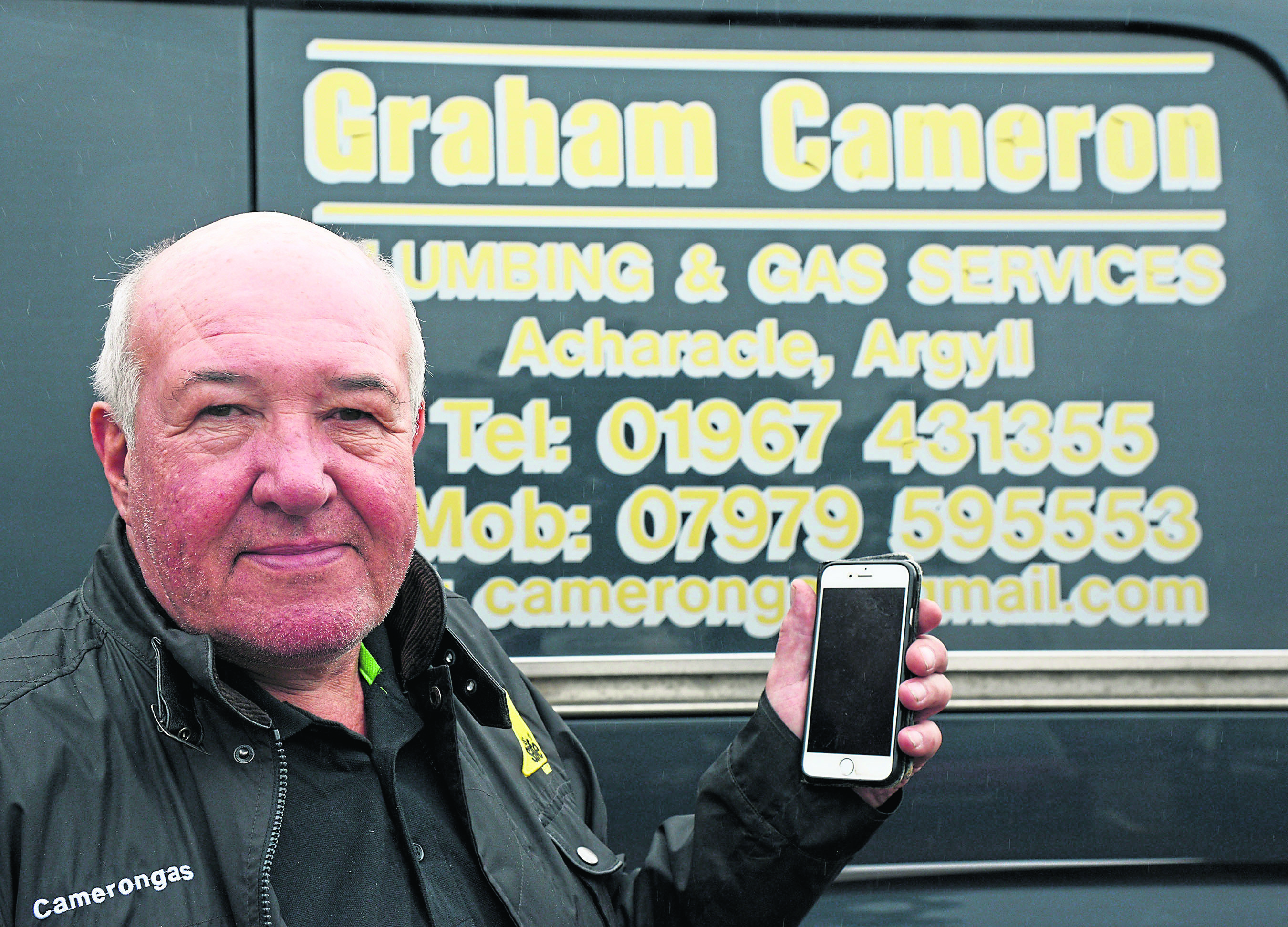 Graham Cameron with a mobile number on his van, but no reception where he lives.