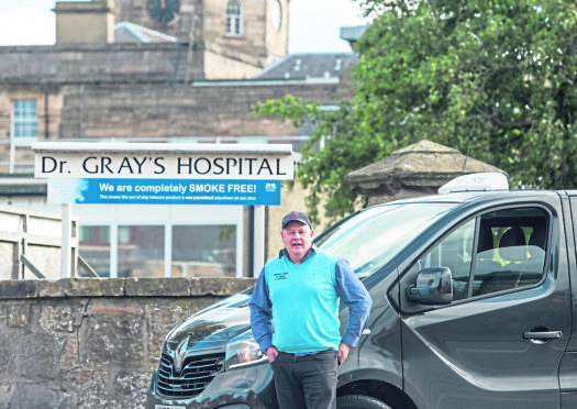 Taxi man Garey Stewart outside of Dr. Grays Hospital in Elgin.