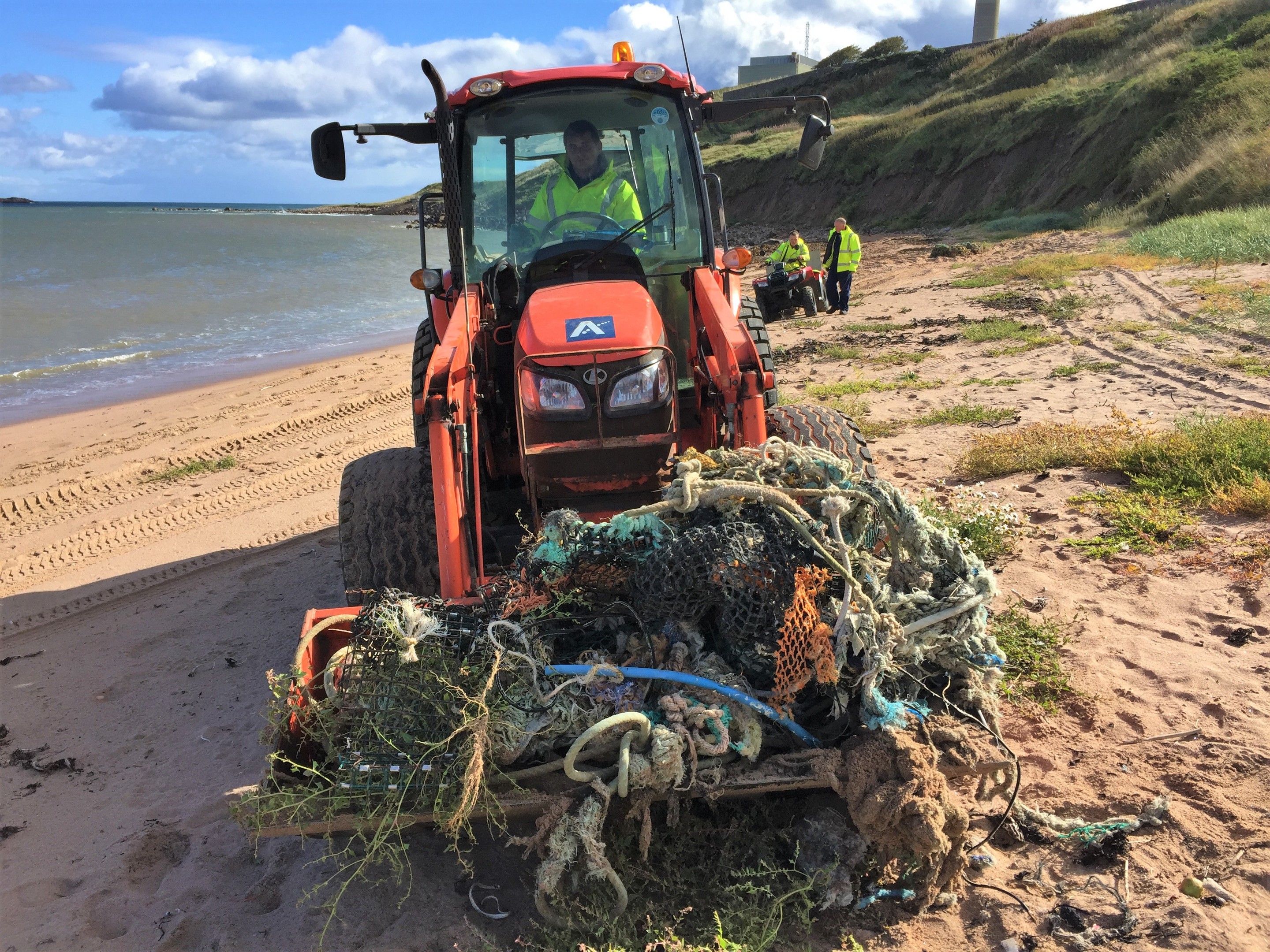 The tractor hauling marine litter from Sandford Bay last weekend