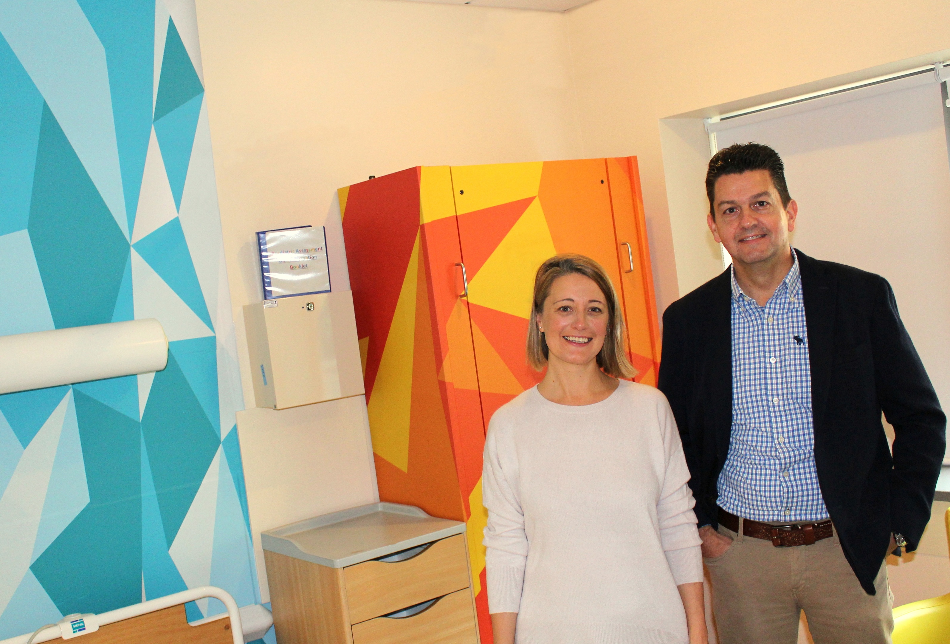 The photo shows Cassie Thompson, ARCHIE Director of Partnerships and Charlie Parker, Financial Director of the John Lawrie Group in one of the refurbished rooms.