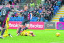 Ross County's Jamie Lindsay scores against Falkirk.