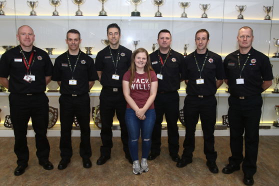 Laura Campbell with members of Scottish Fire and Rescue Service in Oban.