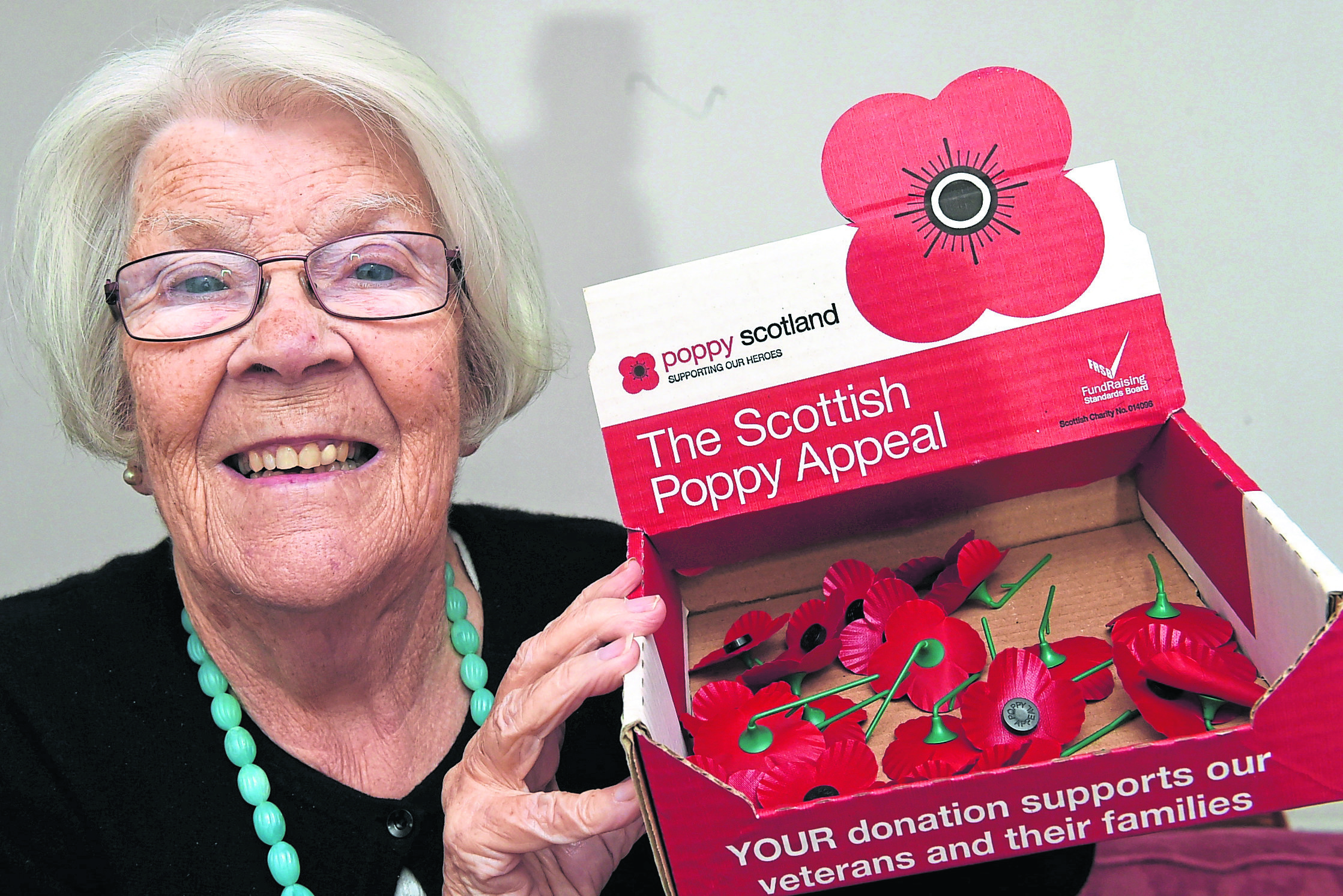 Beryl Watt looking for more help with selling poppies at Whitehills.