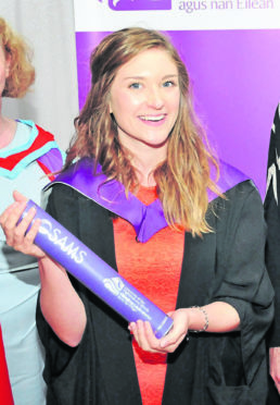 Eleanor Wood, who now works as a research technician at Swansea University, received her award at the SAMS UHI graduation.