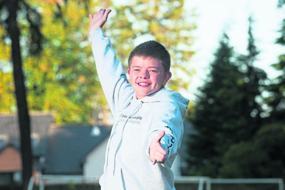 Aidan Henderson of Elgin has organised a Moray-wide talent show by himself in aid of charity. Also in photo is his mother Sally.