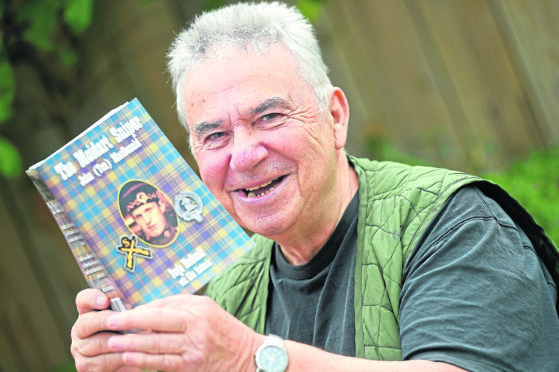 Fergie MacDonald  with the book about his father.