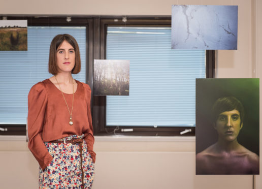 Photographer Hannah Laycock in the exhibition she is hosting at Leanchoil Hospital in Forres.