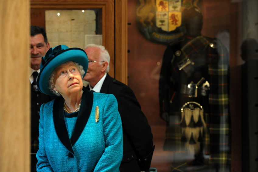 Braemar Gathering 2018, at The Princess Royal and Duke of Fife Memorial Park in Braemar.
The Queen has officially opened a new Highland Games centre - named after her son the Duke of Rothesay.
Picture of the Queen looking around the new pavilion.

Picture by KENNY ELRICK     01/09/2018