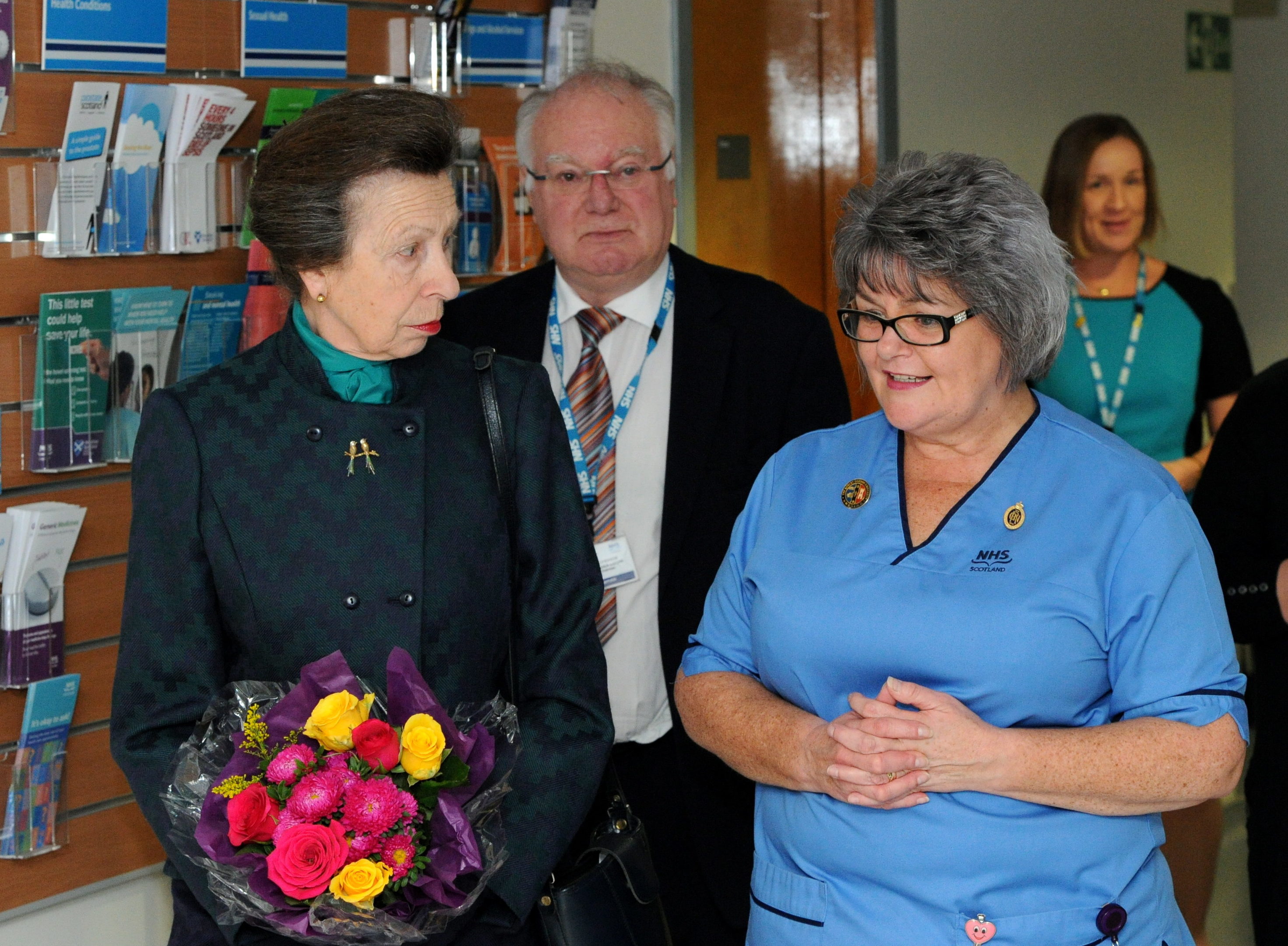 Staff nurse Linda Watt showing Princess Anne around the wards.