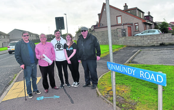 George Wilkinson, Douglas Lamb, Leon Anderson, Jade Forman and Cllr Alan Buchan on Kinmundy Road.