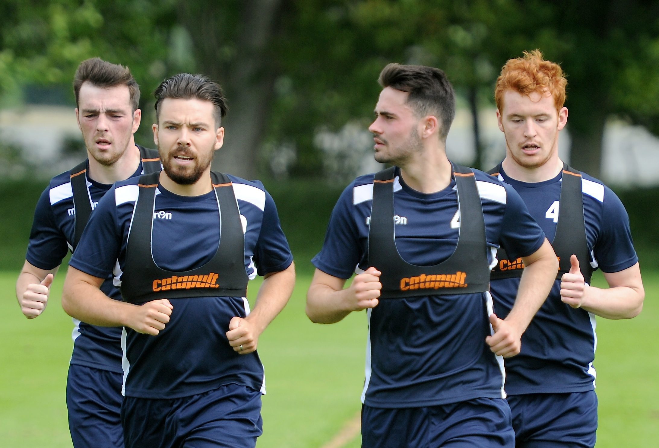 Ryan Dow (second left) and Greg Morrison (far right) during training at Ross County.