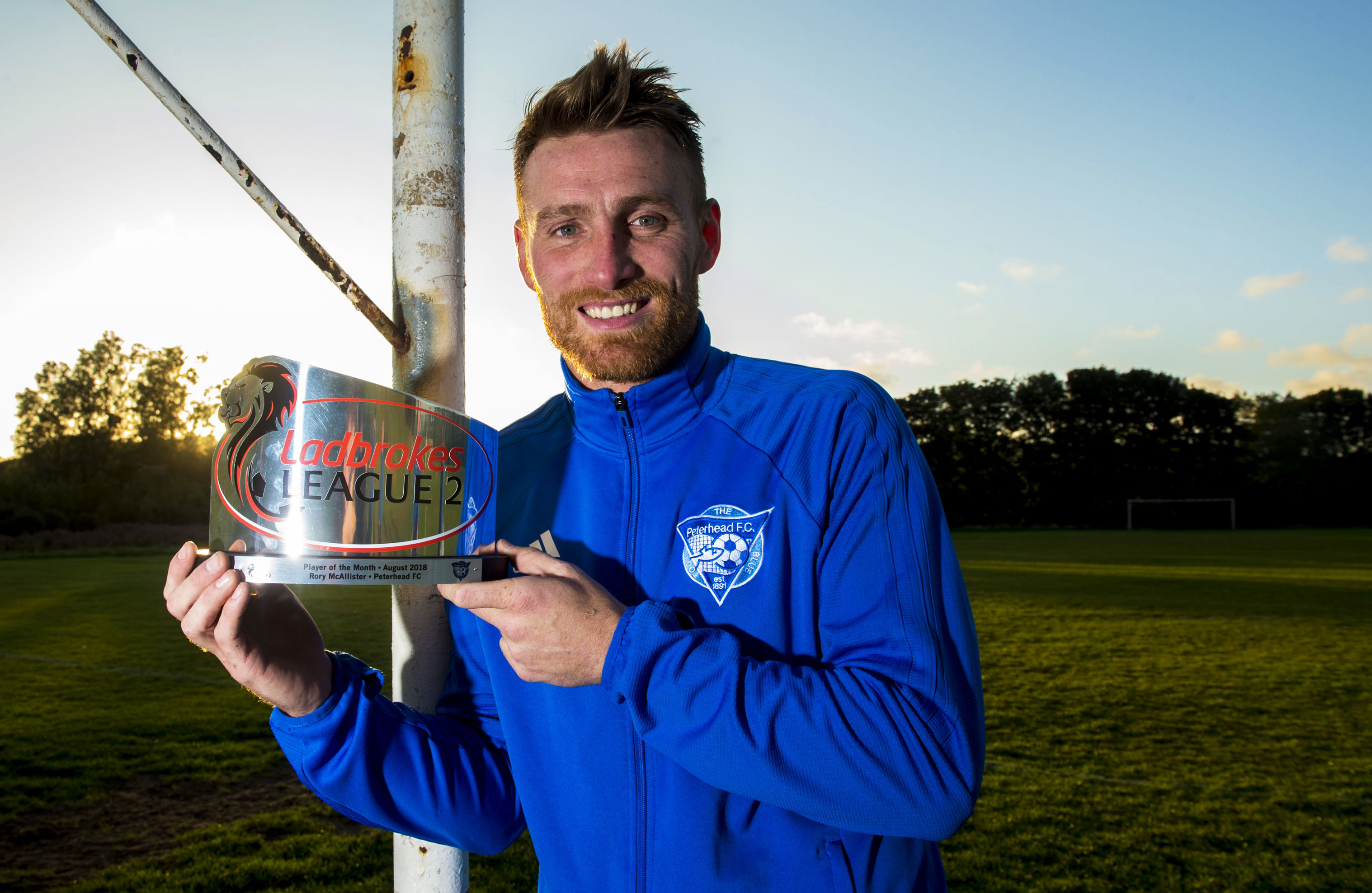 Peterhead forward Rory McAllister with his Ladbrokes League 2 player of the month award for August.