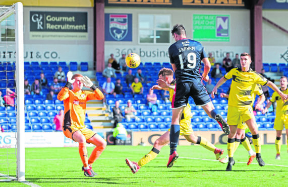 Ross County's Brian Graham scores the 5th goal to make it 5-0.