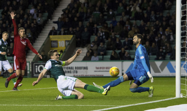 Aberdeen's Joe Lewis saves an attempt from Hibernian's Paul Hanlon.