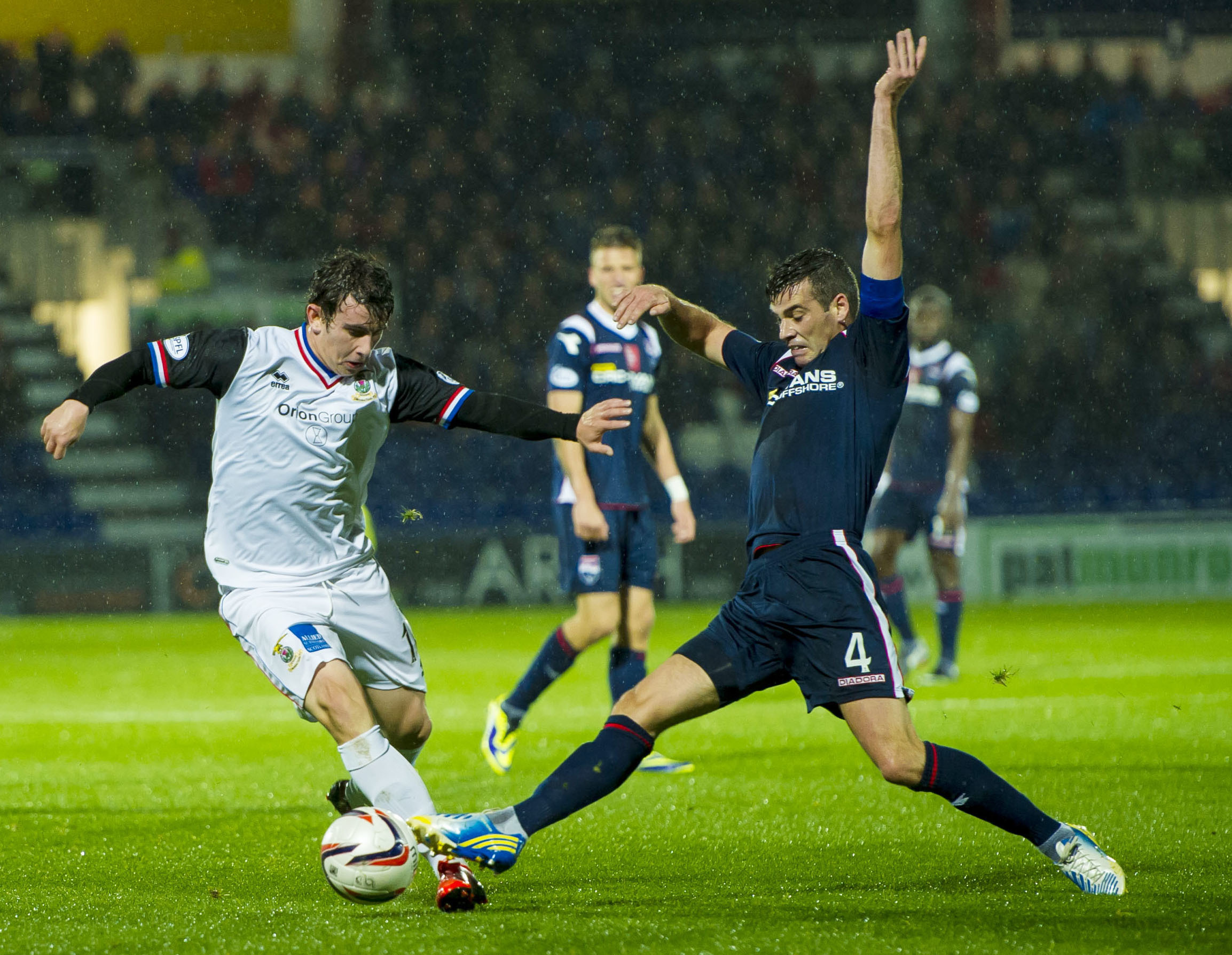Aaron Doran and Stuart Kettlewell contest the ball during the October 2013 derby.