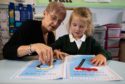 St Peter's Primary School head teacher MandyFeeley and five-year-old pupil Hope Hendry use the maths packs. 


Photo by
Michael Traill
9 South Road
Rhynie
Huntly
AB54 4GA

Contact numbers
Mob07739 38 4792