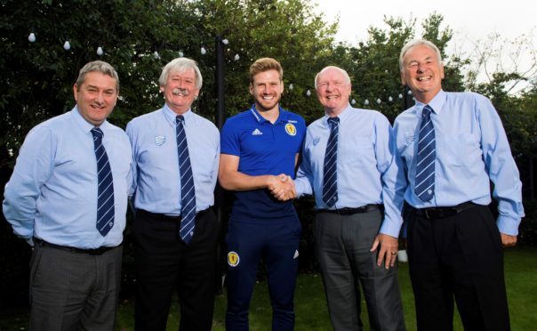 Stuart Armstrong meets representatives of Dyce Boys Club while on international duty last week.