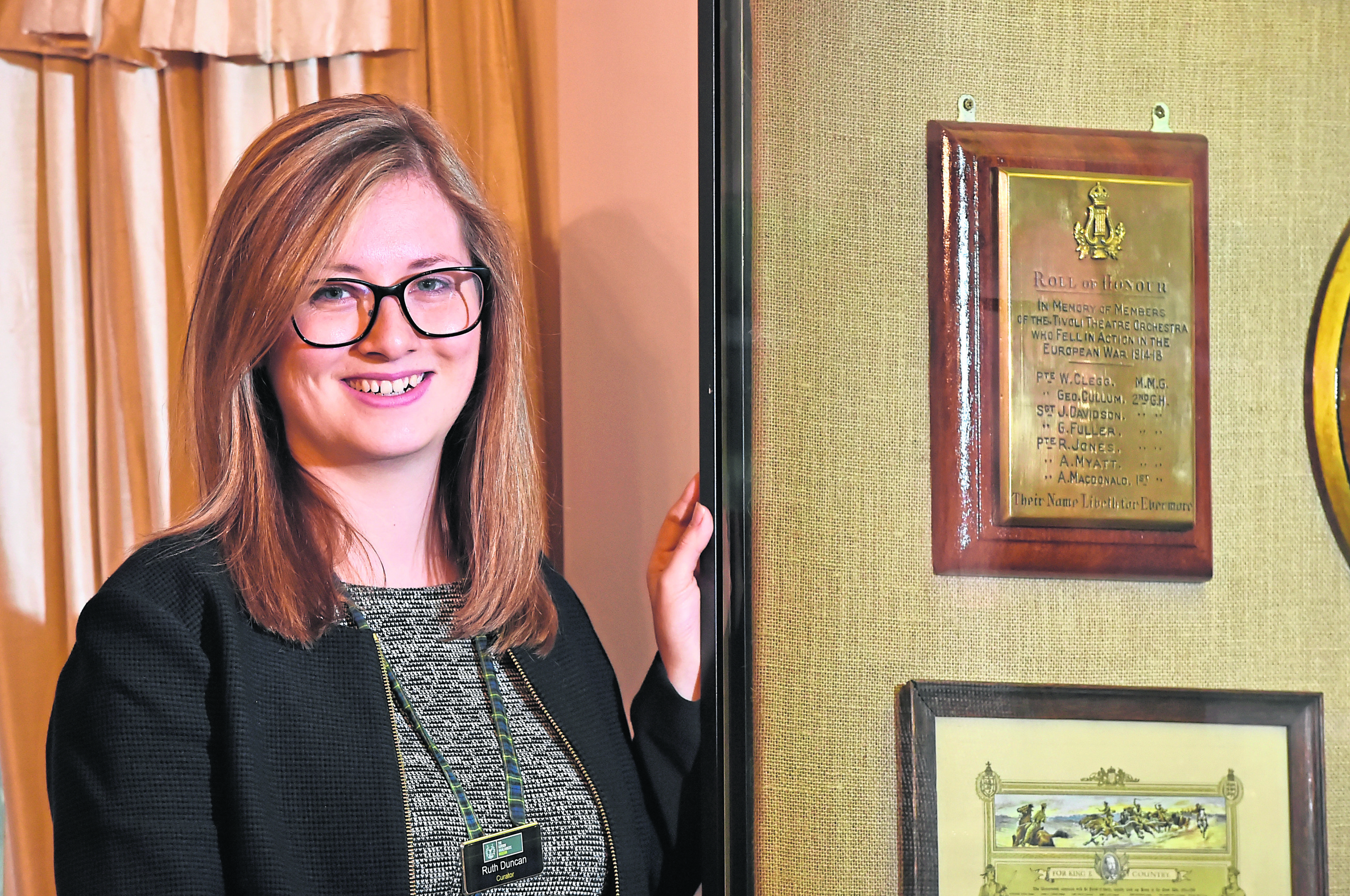 Gordon Highlanders Museum curator Ruth  Cox next to the Roll of Honour plaque. Picture by Kenny Elrick.