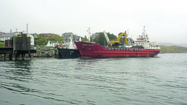 MV Fame yesterday behind Harvest Caroline II.