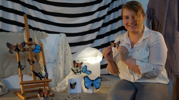 Student Cari Watterton with her butterfly craft kits which she hopes will raise money for conservation.