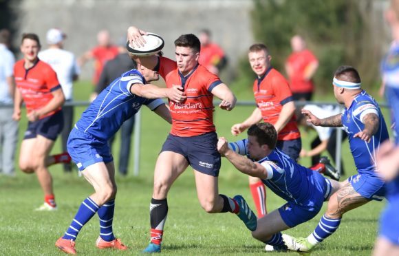 Sean Mills (centre) was misdiagnosed with a suspected broken wrist.