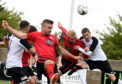 Chris Angus (centre) is confident Locos can deal a double knockout blow to Fraserburgh.