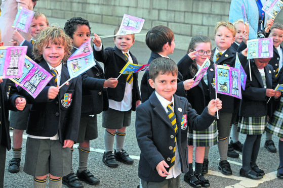 The youngsters of Robert Gordon College march from the college to St Nicholas church, Aberdeen.