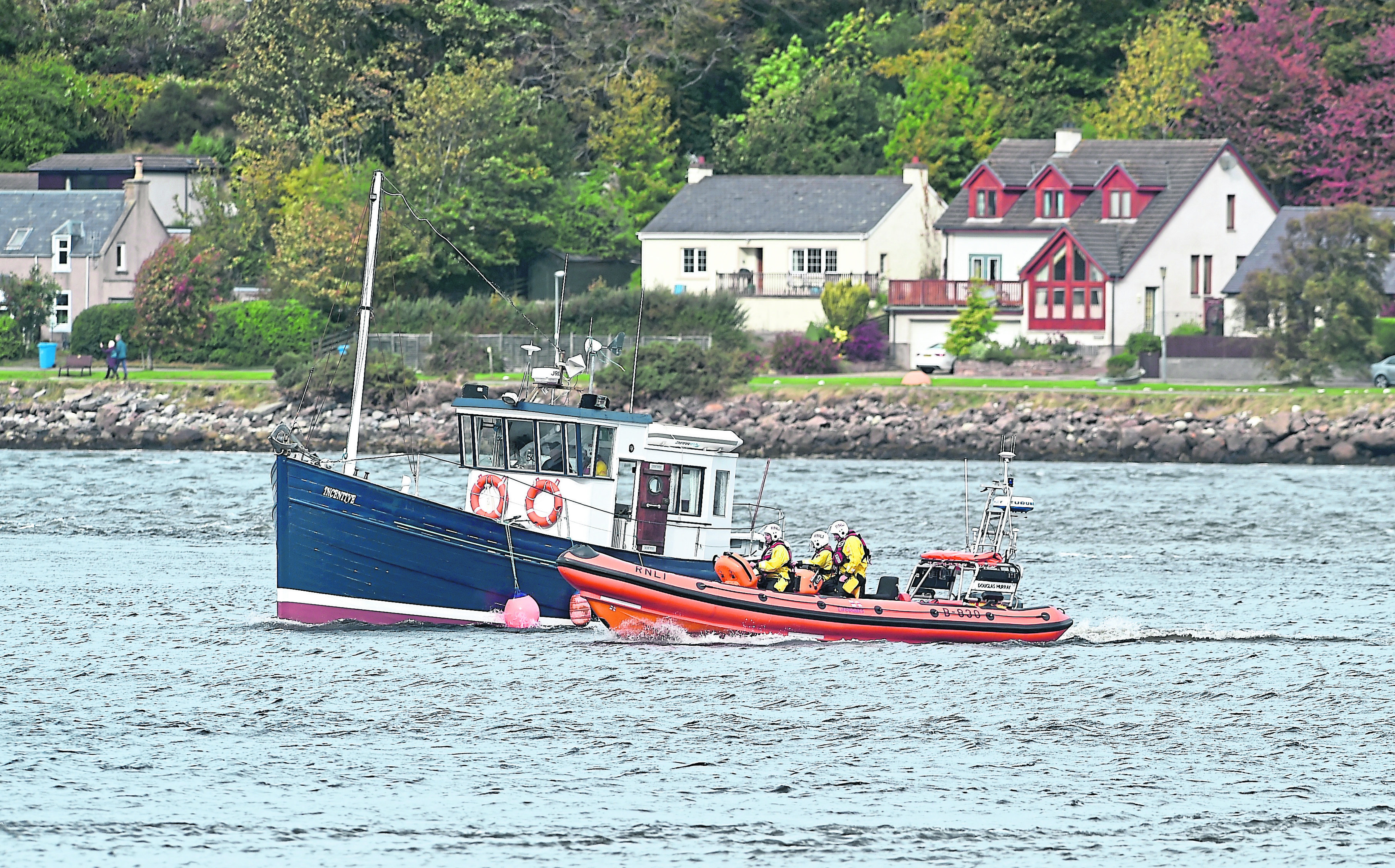 The Incentive  is assisted back in to Inverness Marina by the North Kessock lifeboat.