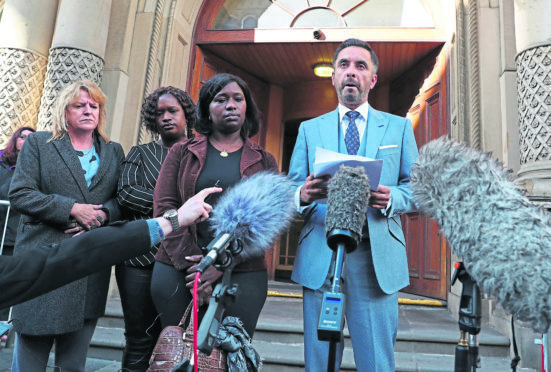 Aamaer Anwar, the lawyer for the family of Sheku Bayoh speaks to the media outside the Crown Office in Edinburgh.