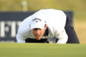 Andrea Pavan of Italy lines up a putt on the ninth green