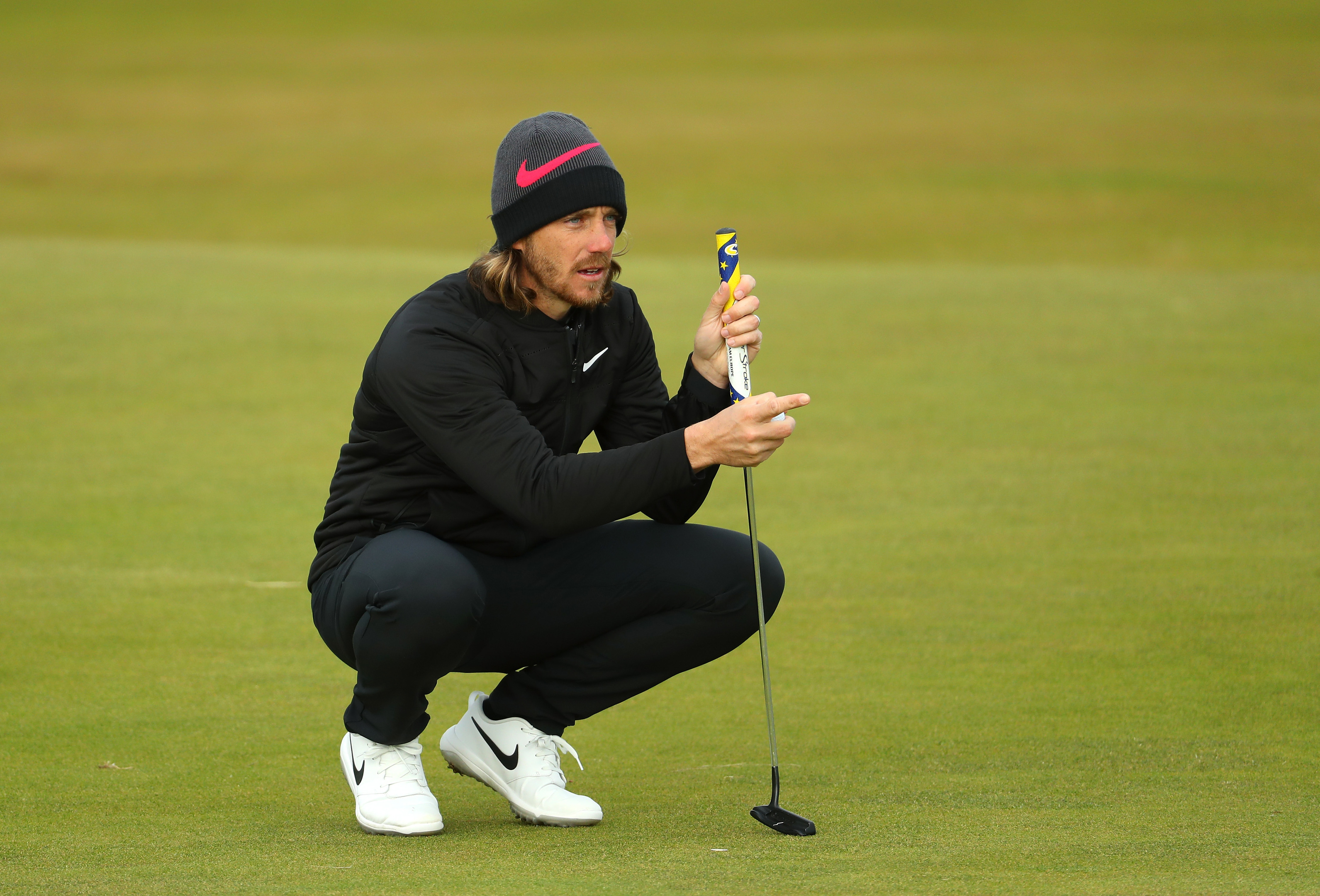 Tommy Fleetwood of England lines up a putt in his final round at St Andrews