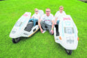 John Igesund with his two sons Jack and Olly, has two Sinclair C5s which are mini electric/pedal power vehicles from the 80s.
