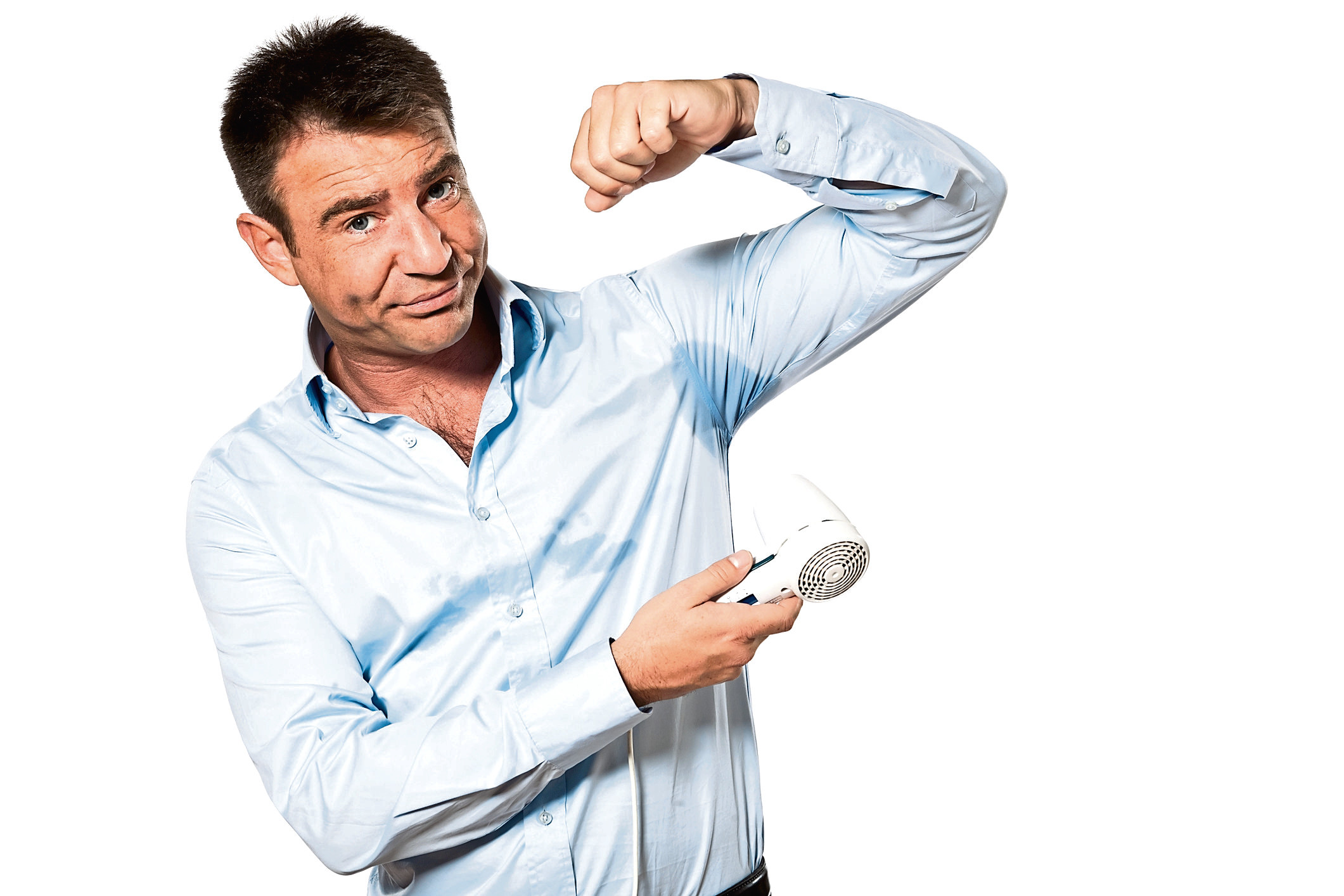 one caucasian man with sweat stain perspire drying shirt with hair dryer in studio isolated on white background