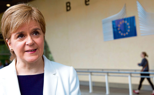Scotland's Prime Minister Nicola Sturgeon speaks with the media outside EU headquarters in Brussels.