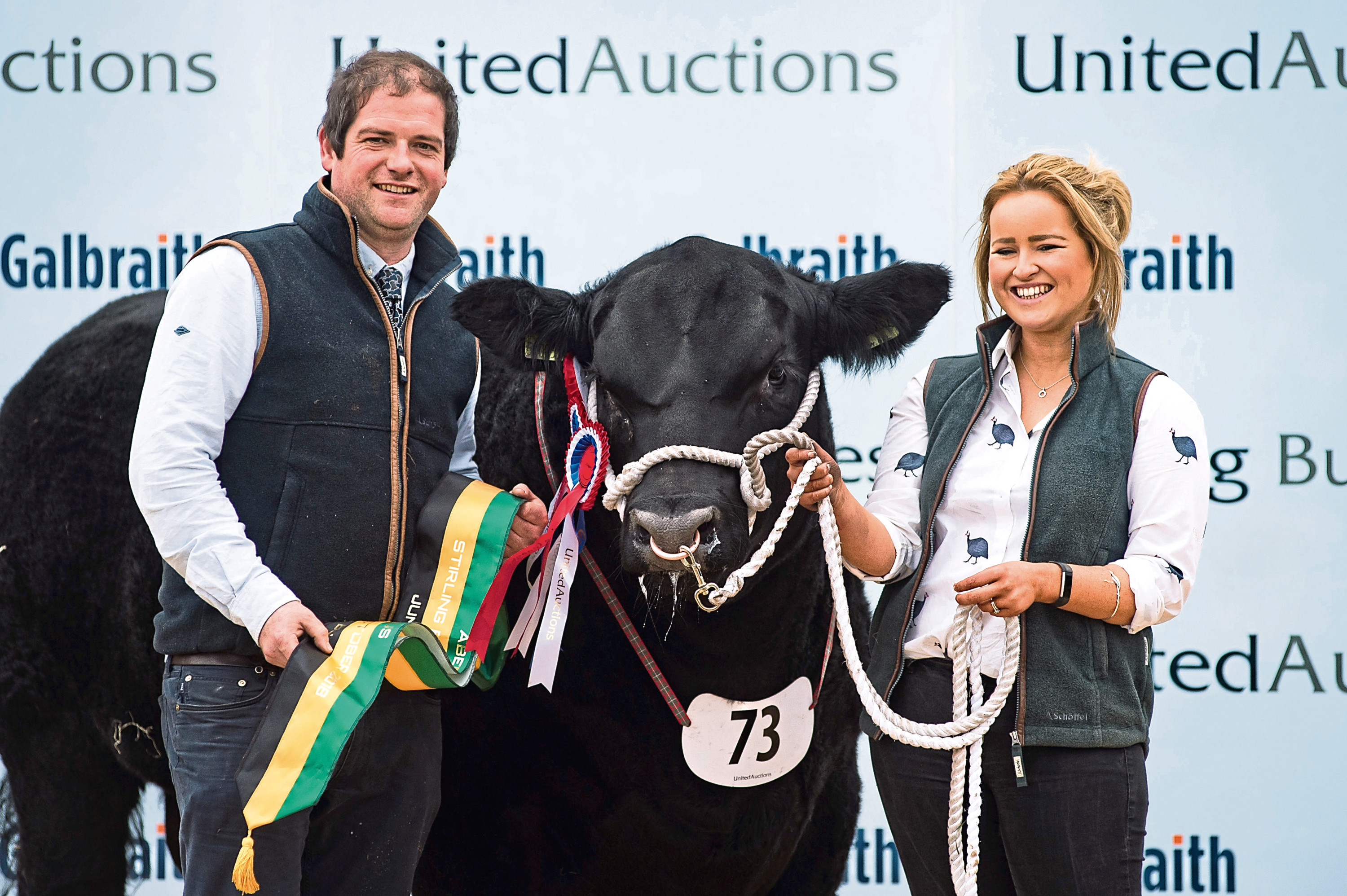 Hugh and Cara Thomson with their 13,000gn Angus bull.