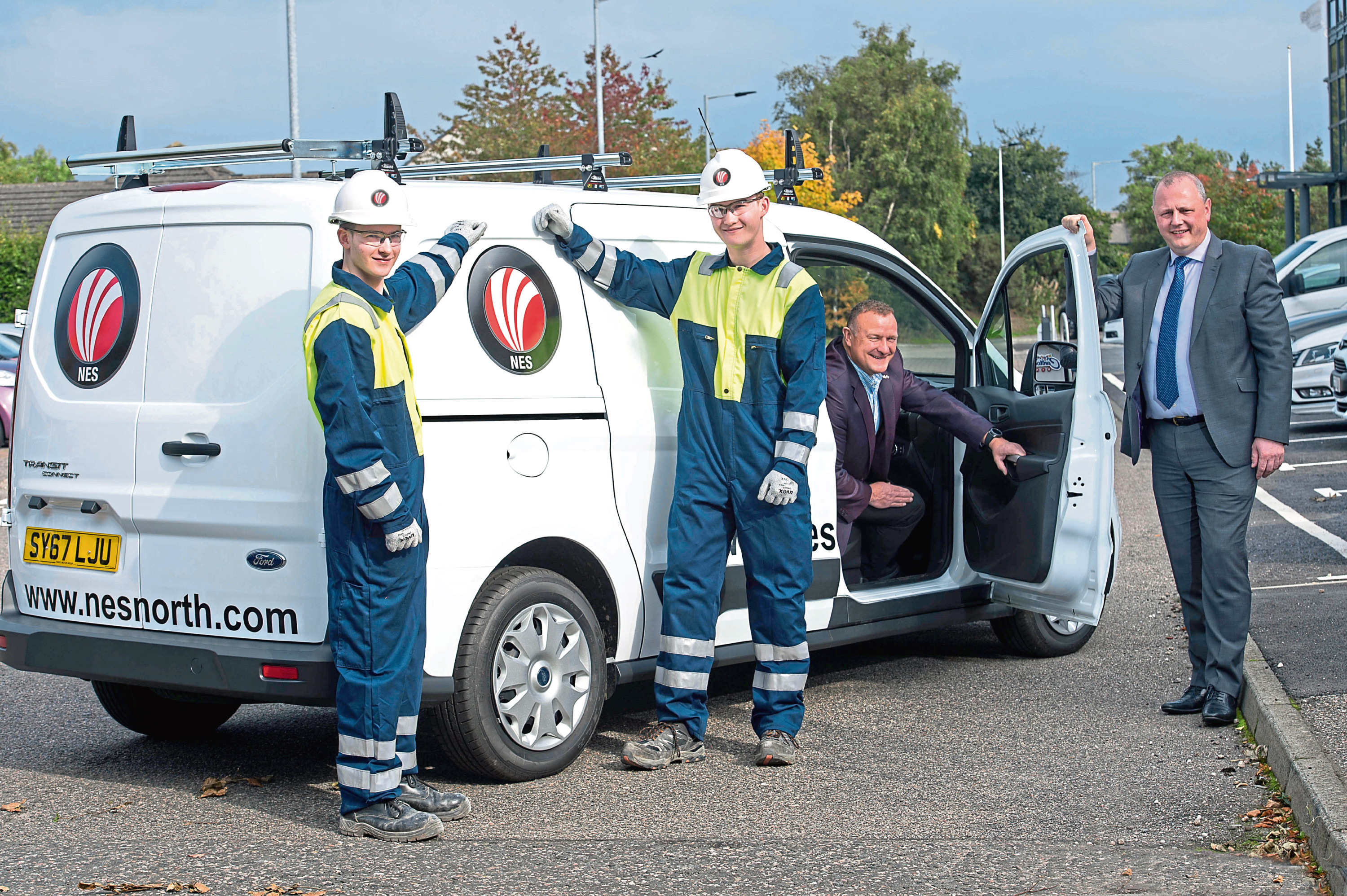 NES Electrical Firm Targets Surge Growth
Drew Hendry MP with
Kenny Duncan, NES managing director
with  Apprentices  Tyler Whitty (17) and Kyle Livingstone (18

Picture by Trevor Martin.
