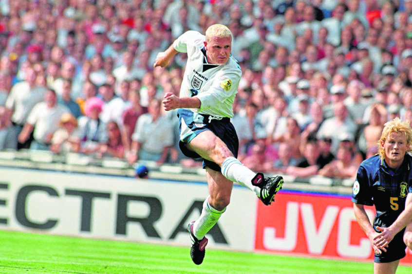 Paul Gascoigne scores England's second goal in spectacular fashion as Scotland's Colin Hendry (right) can only look on.