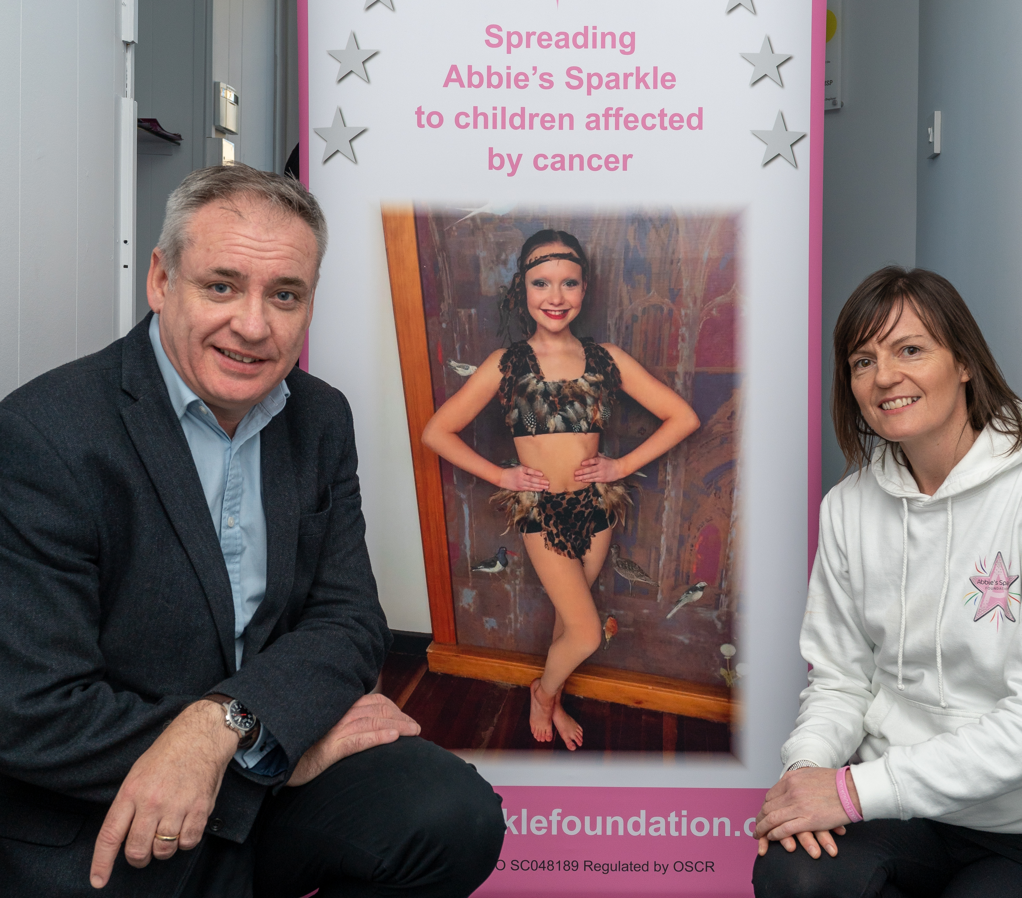 Moray MSP Richard Lochhead and Abbie's mum, Tammy Main, launch the competition to design a Christmas card to support Abbie's Sparkle Foundation.