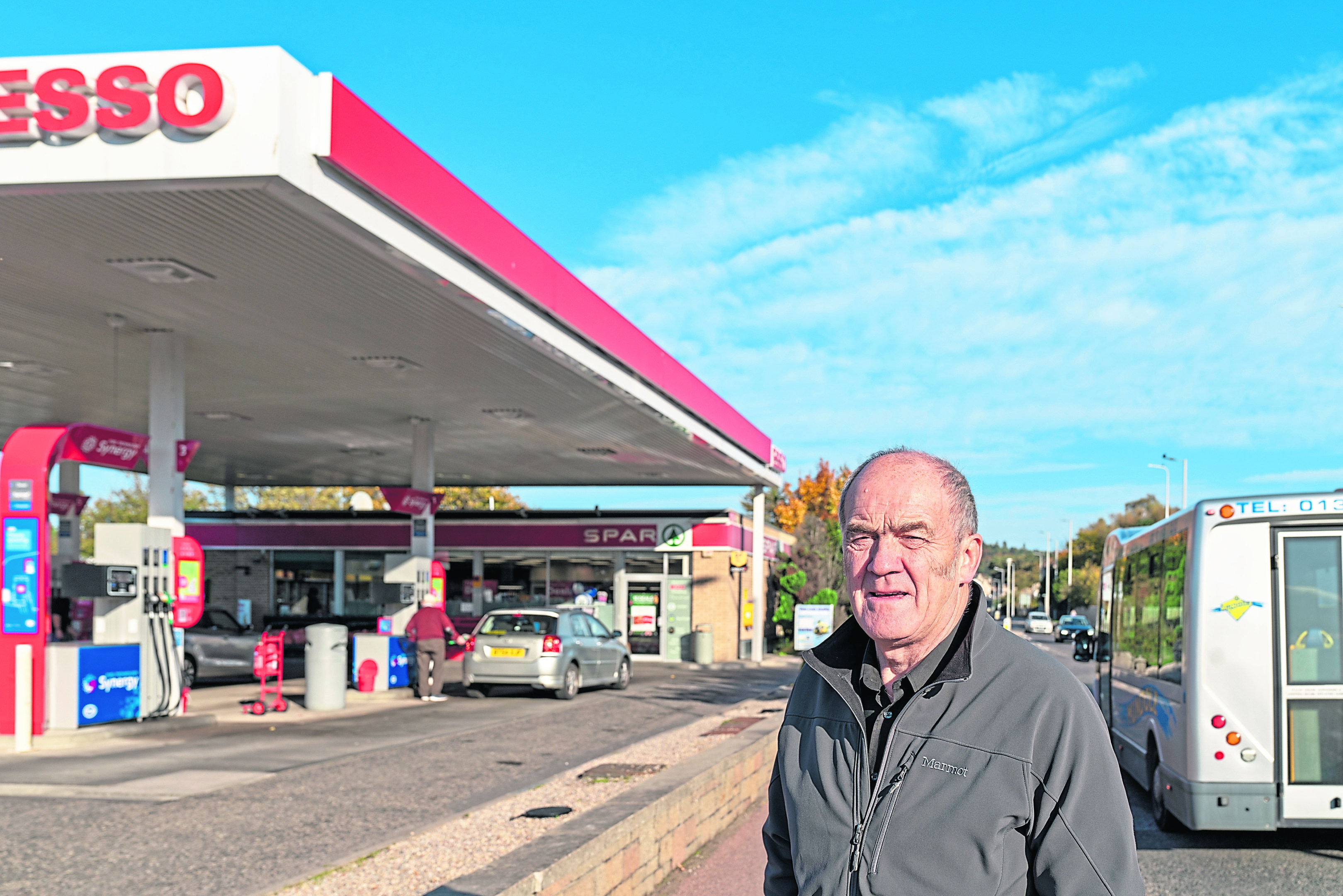 Cllr George Alexander from Forres outside the Esso Filling Station on Nairn Road, Forres, Moray.