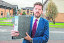 Dr Iain Kennedy holds a file which contains more than 100 reported incidents alleging bullying in NHS Highlands workplaces.