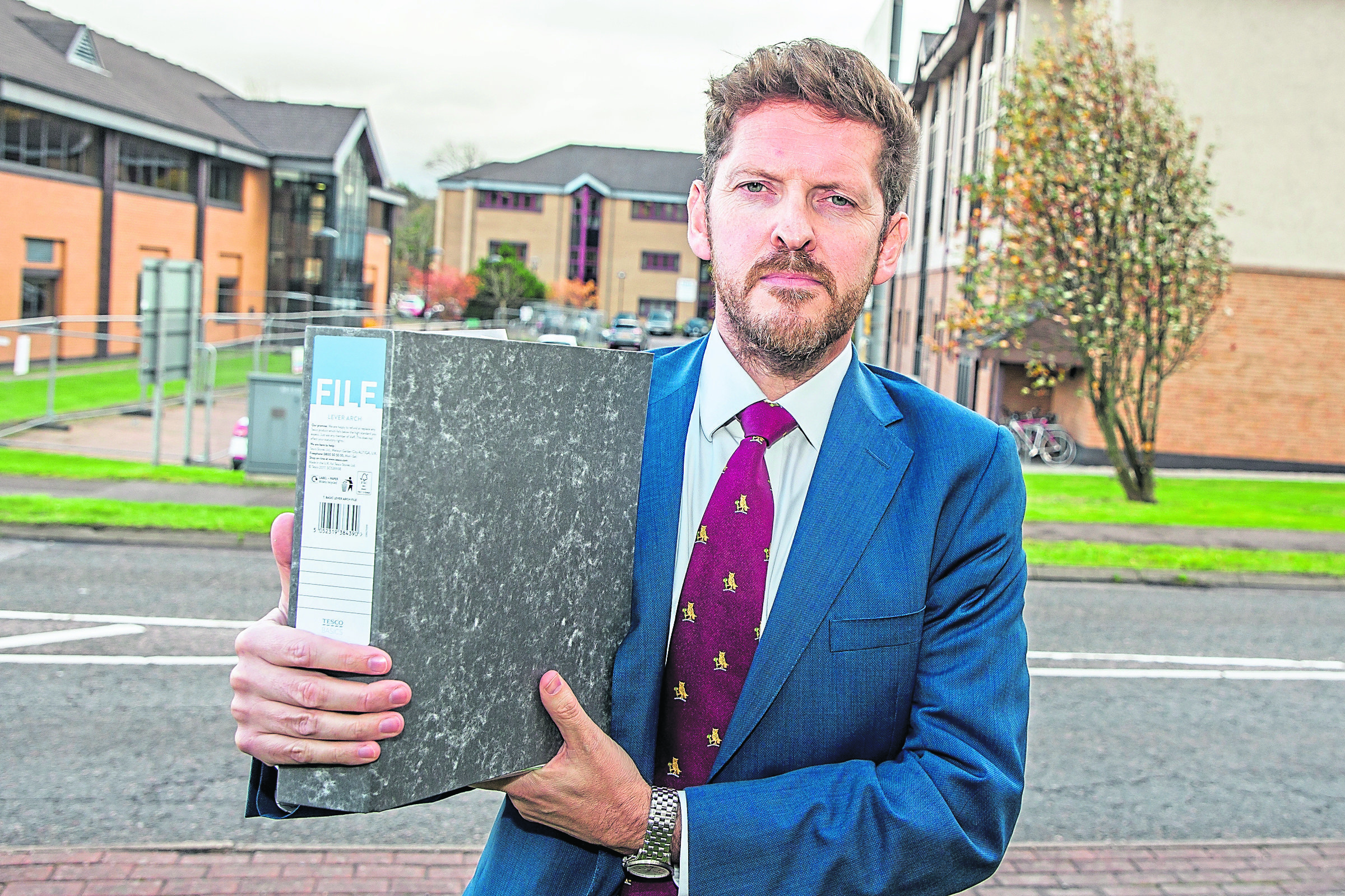 Dr Iain Kennedy holds a file which contains more than 100 reported incidents alleging bullying in NHS Highlands workplaces.