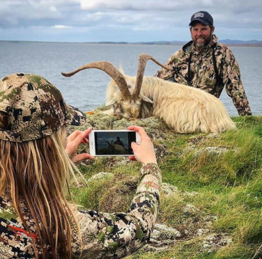 Larysa and her companion with the dead goat.