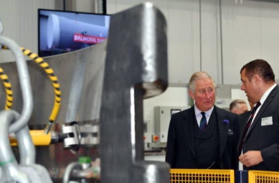 HRH Prince Charles, The Duke of Rothesay, visited Balmoral Offshore Engineering, Aberdeen to officially open the new Balmoral Subsea Test Centre. Pictured - Prince Charles is shown around the new test centre by Derek Weir.