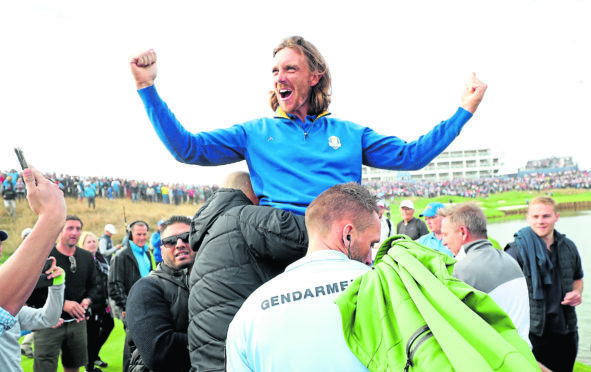 Team Europe's Tommy Fleetwood celebrates after Europe win the Ryder Cup at Le Golf National, Saint-Quentin-en-Yvelines, Paris.