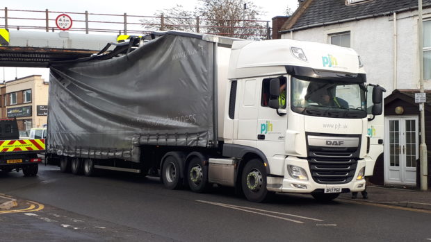 HGV lorry trapped below the Shore Street Bridge this morning.