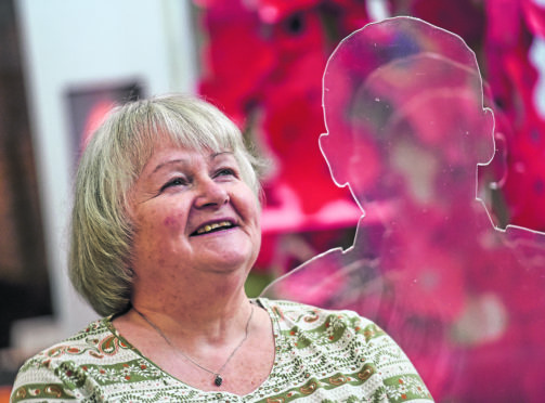 The silhouettes currently on display at Elgin Museum, volunteer Gayle Henderson is pictured. Picture by Jason Hedges.